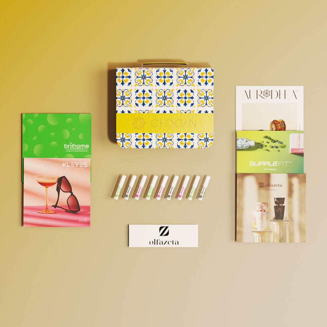 Kit de muestras Olfazeta by Chogan: hilera de viales, estuche azulejos Chogan y catálogos de marcas sobre fondo beige